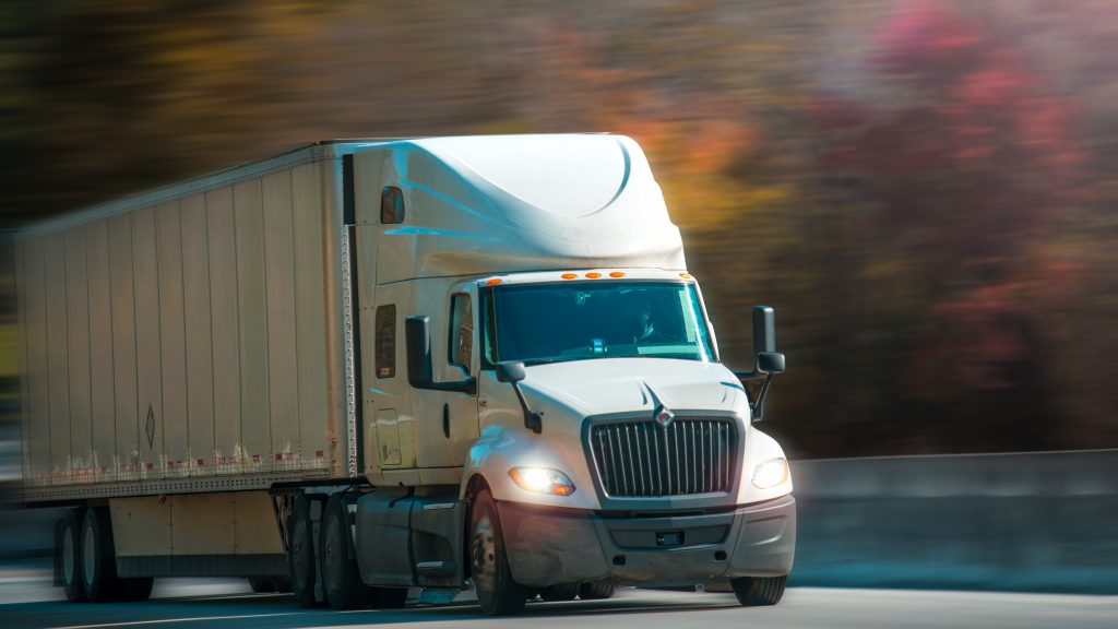Truck with trailer on highway. Truck Driver company. Trucking jobs. Copy space.